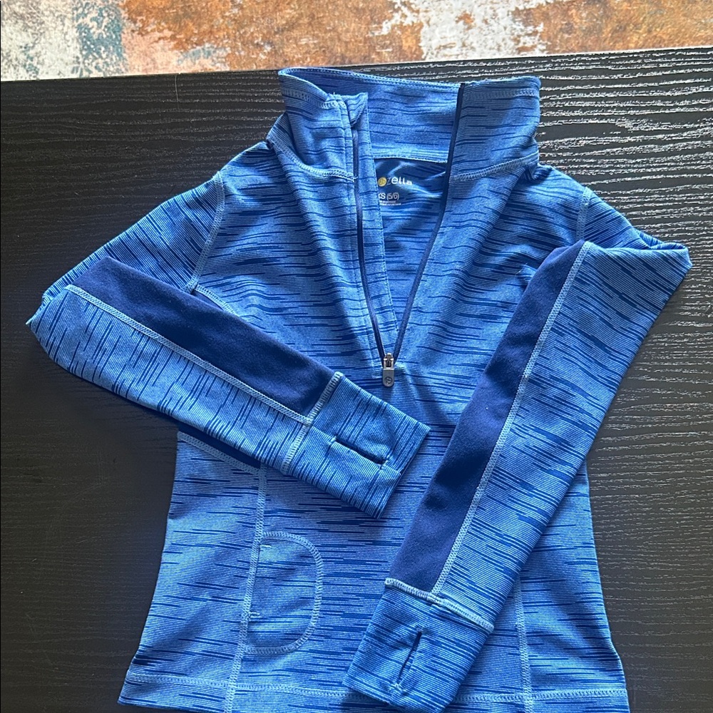 Zella Blue Striped Long sleeve Pullover Shirt with half zipper.
